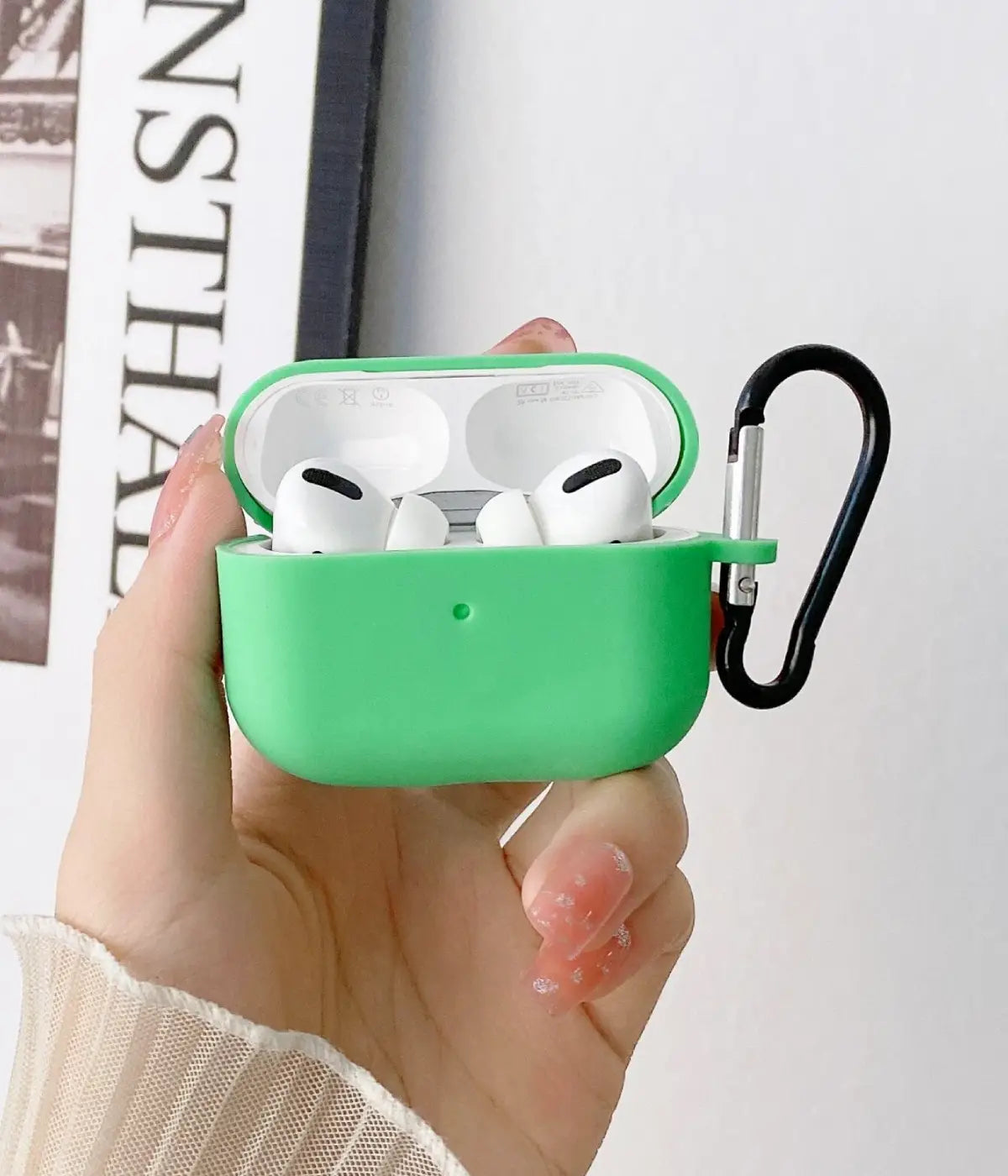 A mint green liquid silicone case for the Airpods.