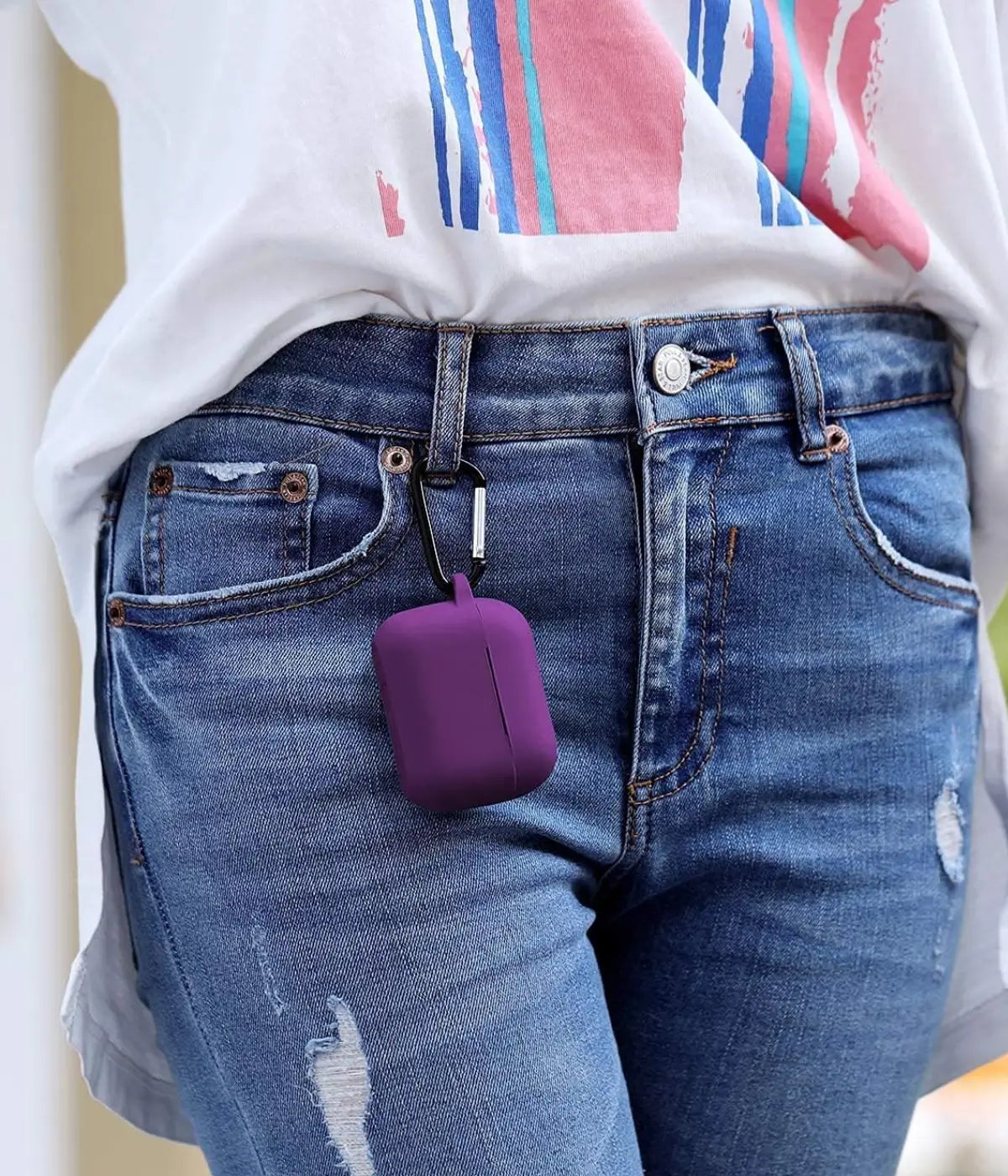 Purple airpods case with carabiner held by a hand.