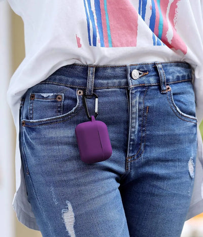 Purple airpods case with carabiner held by a hand.