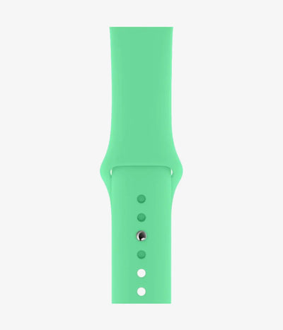 Close-up of the silicone Apple Watch band, showcasing its smooth finish and secure pin-and-tuck closure mechanism.