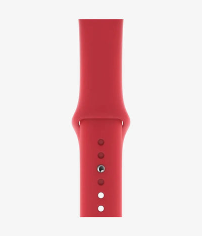 Close-up of the silicone Apple Watch band, showcasing its smooth finish and secure pin-and-tuck closure mechanism.