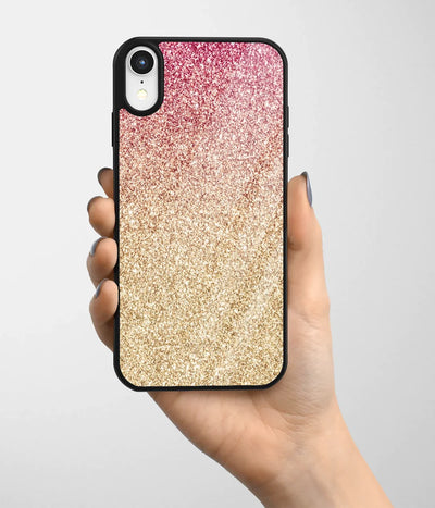 A hand holding a glass phone case with a colorful design.