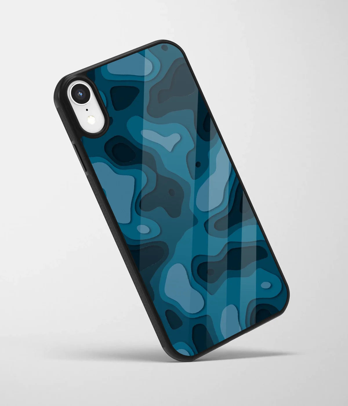 An angled view of a glass phone case featuring a vibrant design.