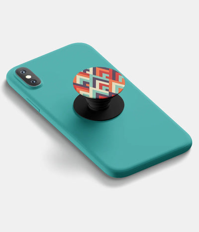 A top-down view of a phone grip holder attached to a mobile phone case on a white background