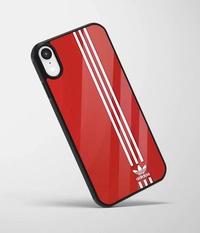 An angled view of a glass phone case featuring a vibrant design.