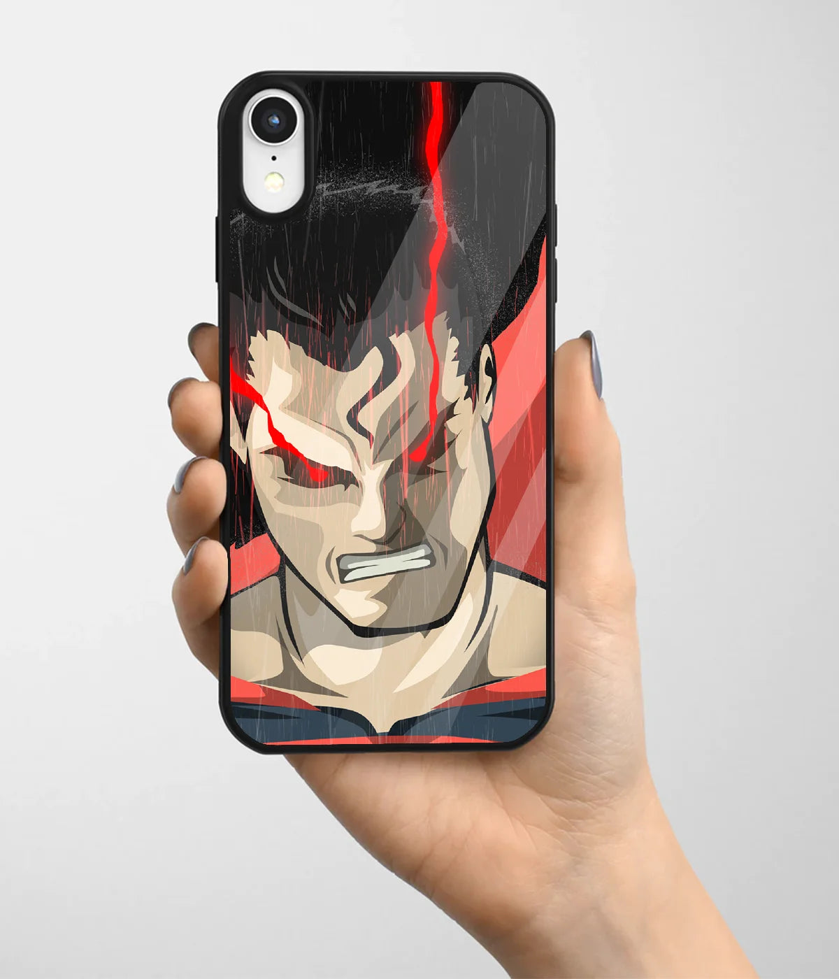 A hand holding a glass phone case with a colorful design.