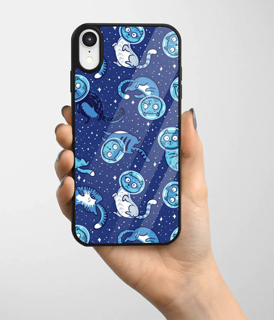 A hand holding a glass phone case with a colorful design.
