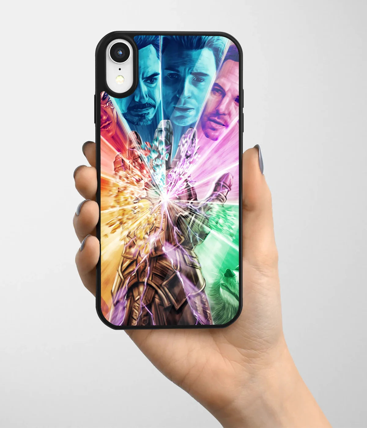 A hand holding a glass phone case with a colorful design.