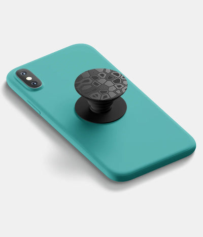A top-down view of a phone grip holder attached to a mobile phone case on a white background