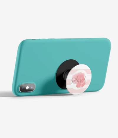 An image demonstrating how to use the phone grip as a stand to hold a mobile phone in landscape mode for hands-free viewing