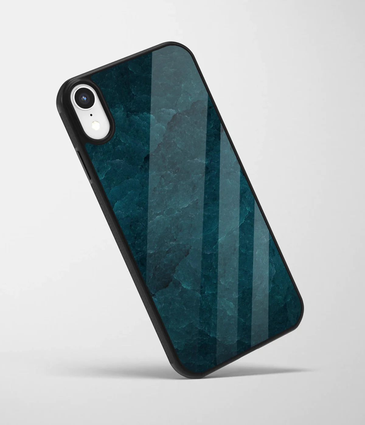 An angled view of a glass phone case featuring a vibrant design.
