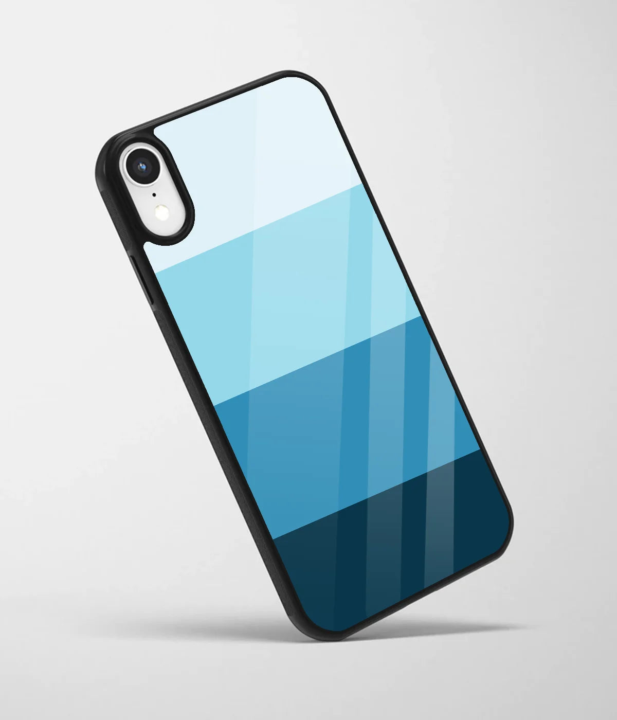 An angled view of a glass phone case featuring a vibrant design.