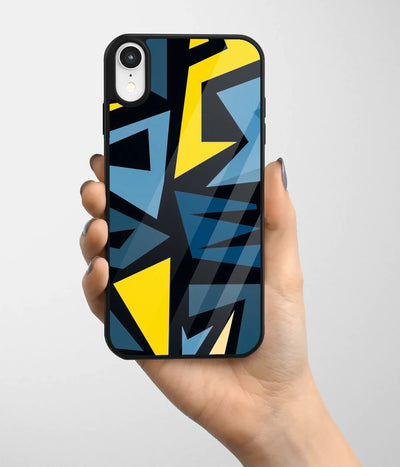 A hand holding a glass phone case with a colorful design.