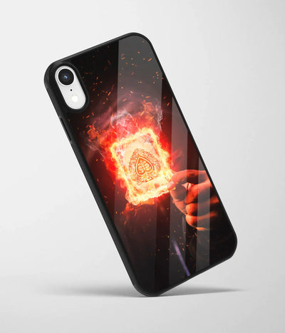 An angled view of a glass phone case featuring a vibrant design.