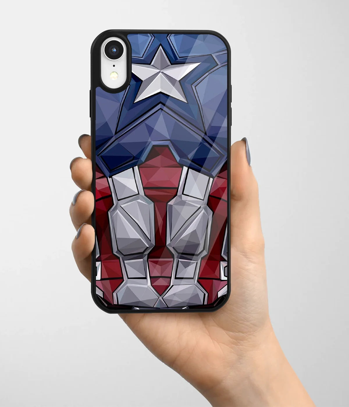 A hand holding a glass phone case with a colorful design.