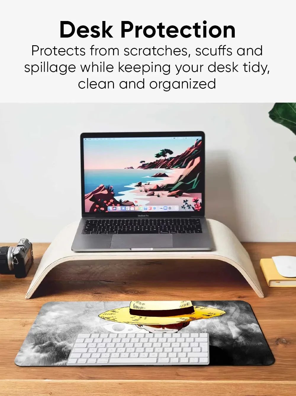 Casemonkey desk mat protecting a wooden desk surface from scratches, scuffs, and spills, illustrating the desk protection feature for a clean and organized workspace.