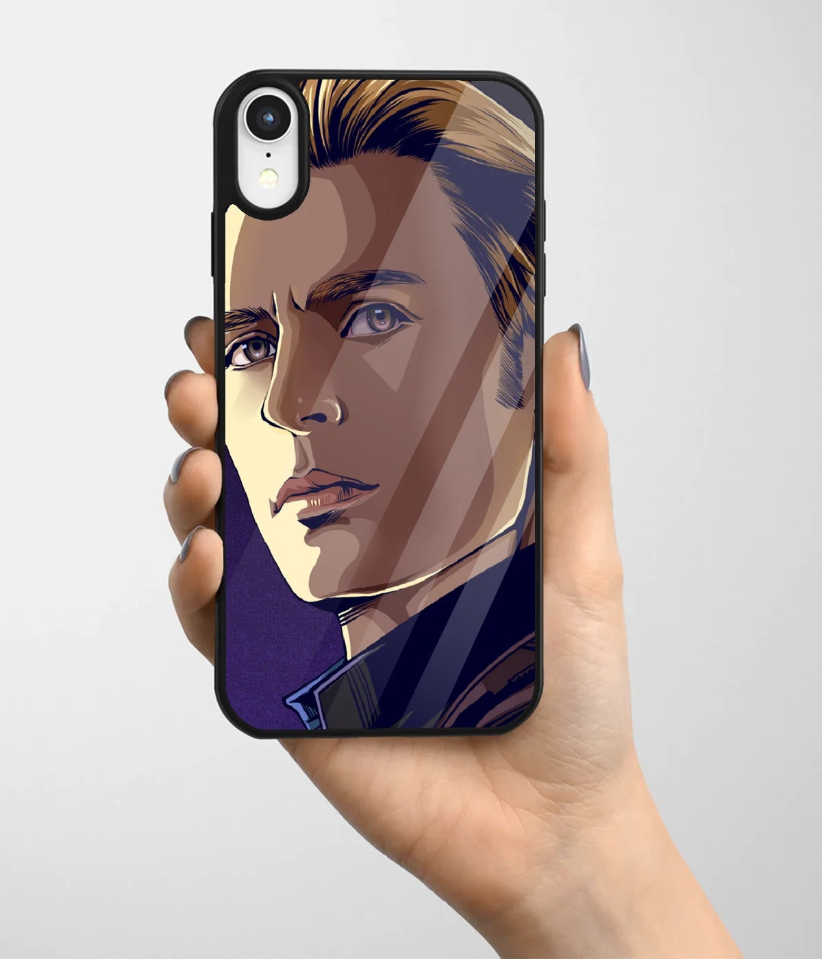 A hand holding a glass phone case with a colorful design.