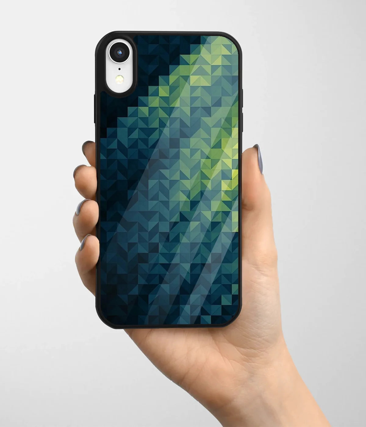 A hand holding a glass phone case with a colorful design.