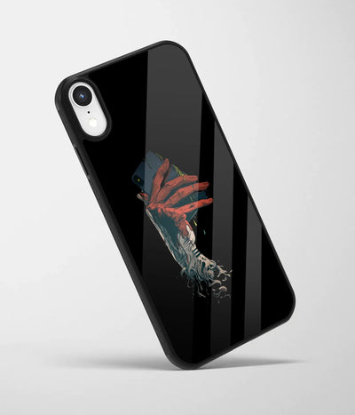 An angled view of a glass phone case featuring a vibrant design.