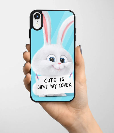 A hand holding a glass phone case with a colorful design.
