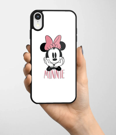 A hand holding a glass phone case with a colorful design.