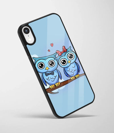 An angled view of a glass phone case featuring a vibrant design.