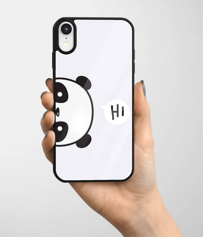 A hand holding a glass phone case with a colorful design.