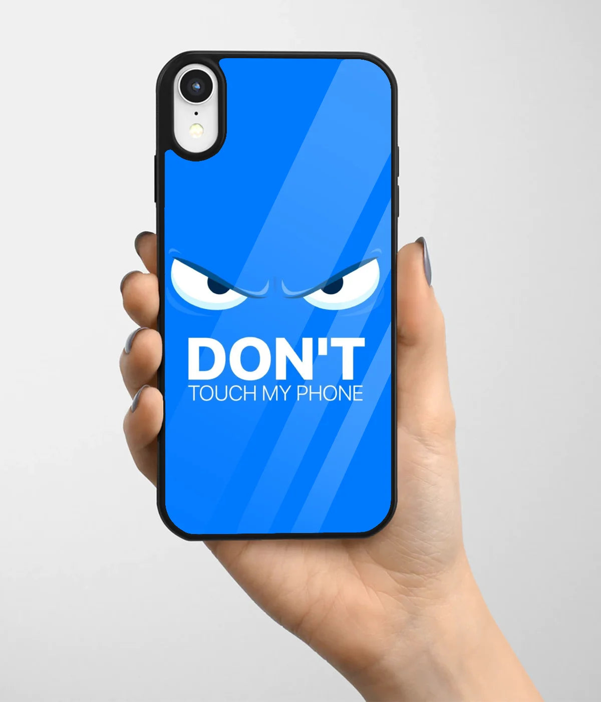 A hand holding a glass phone case with a colorful design.