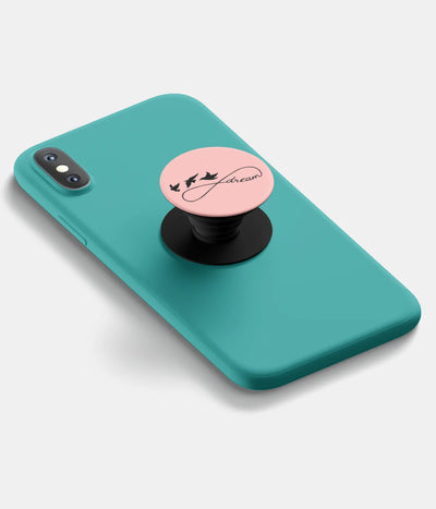 A top-down view of a phone grip holder attached to a mobile phone case on a white background