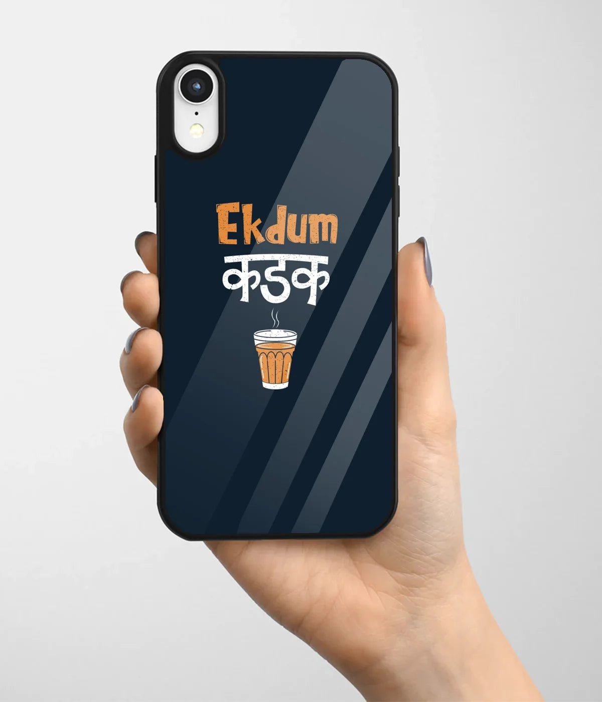 A hand holding a glass phone case with a colorful design.