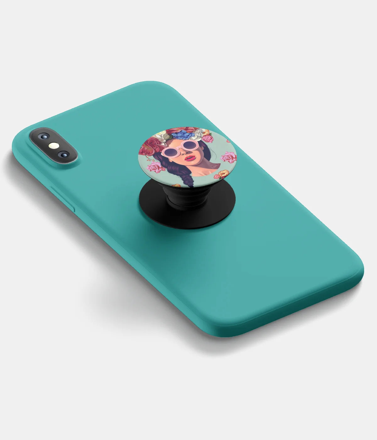 A top-down view of a phone grip holder attached to a mobile phone case on a white background