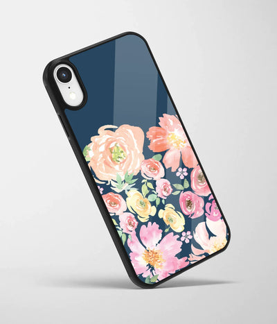 An angled view of a glass phone case featuring a vibrant design.