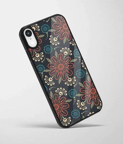 An angled view of a glass phone case featuring a vibrant design.