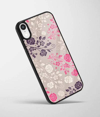 An angled view of a glass phone case featuring a vibrant design.