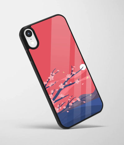 An angled view of a glass phone case featuring a vibrant design.