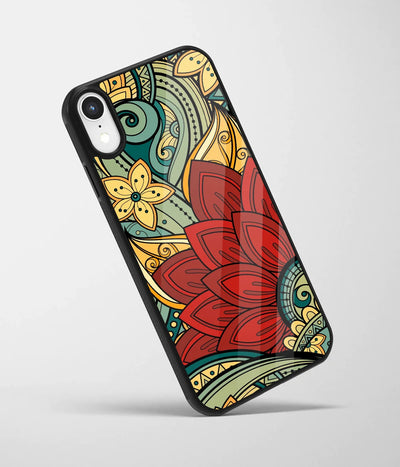 An angled view of a glass phone case featuring a vibrant design.