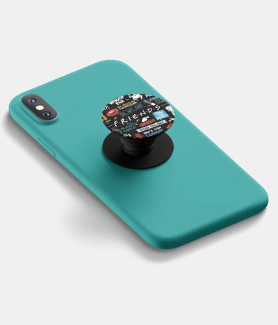 A top-down view of a phone grip holder attached to a mobile phone case on a white background