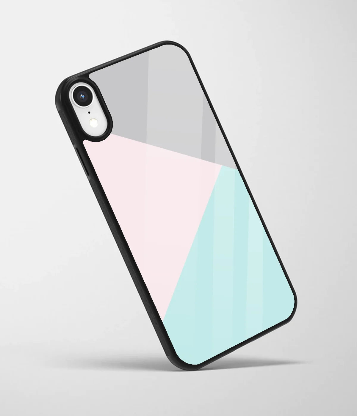 An angled view of a glass phone case featuring a vibrant design.