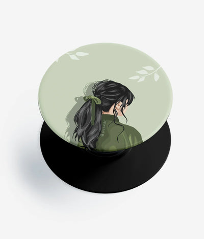 A top-down view of a phone grip holder on a clean white background