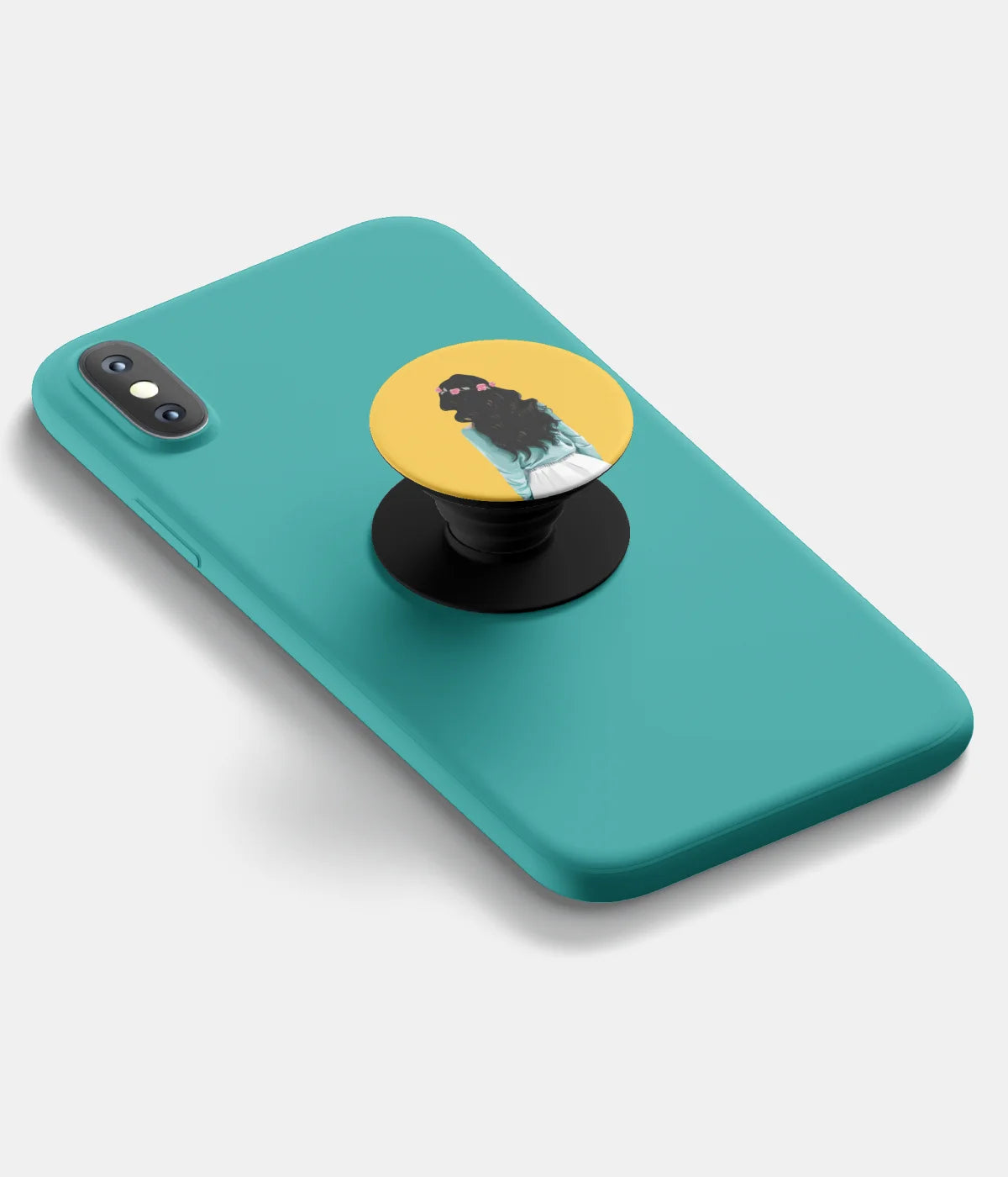 A top-down view of a phone grip holder attached to a mobile phone case on a white background