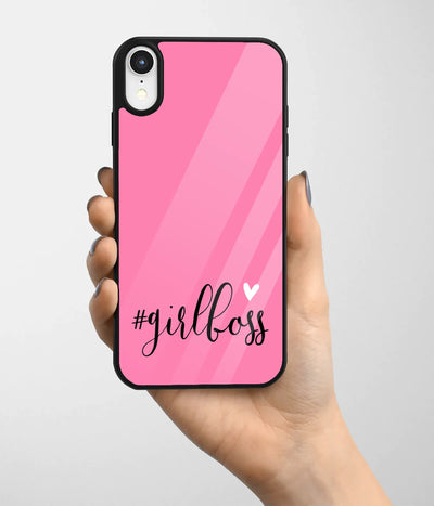 A hand holding a glass phone case with a colorful design.