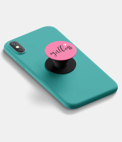 A top-down view of a phone grip holder attached to a mobile phone case on a white background
