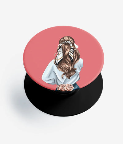 A top-down view of a phone grip holder on a clean white background