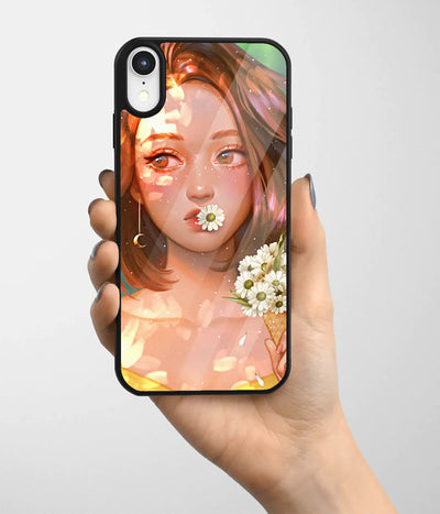 A hand holding a glass phone case with a colorful design.