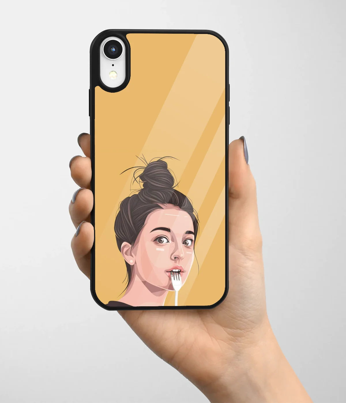 A hand holding a glass phone case with a colorful design.