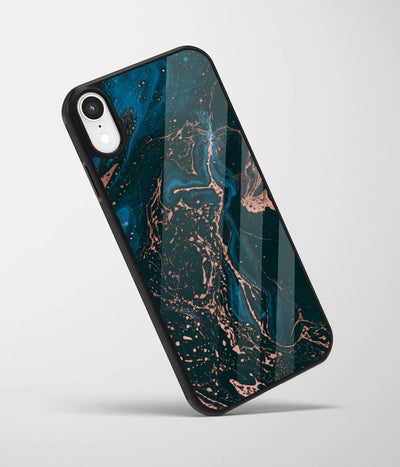 An angled view of a glass phone case featuring a vibrant design.