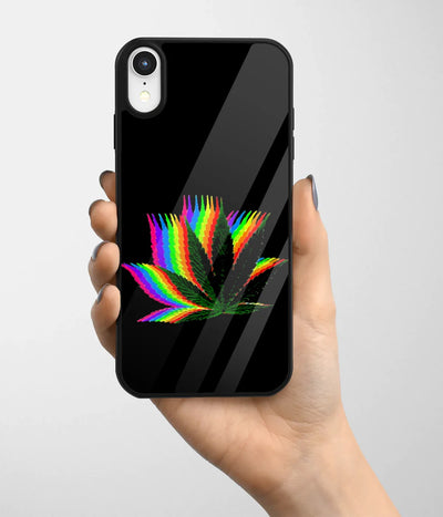 A hand holding a glass phone case with a colorful design.