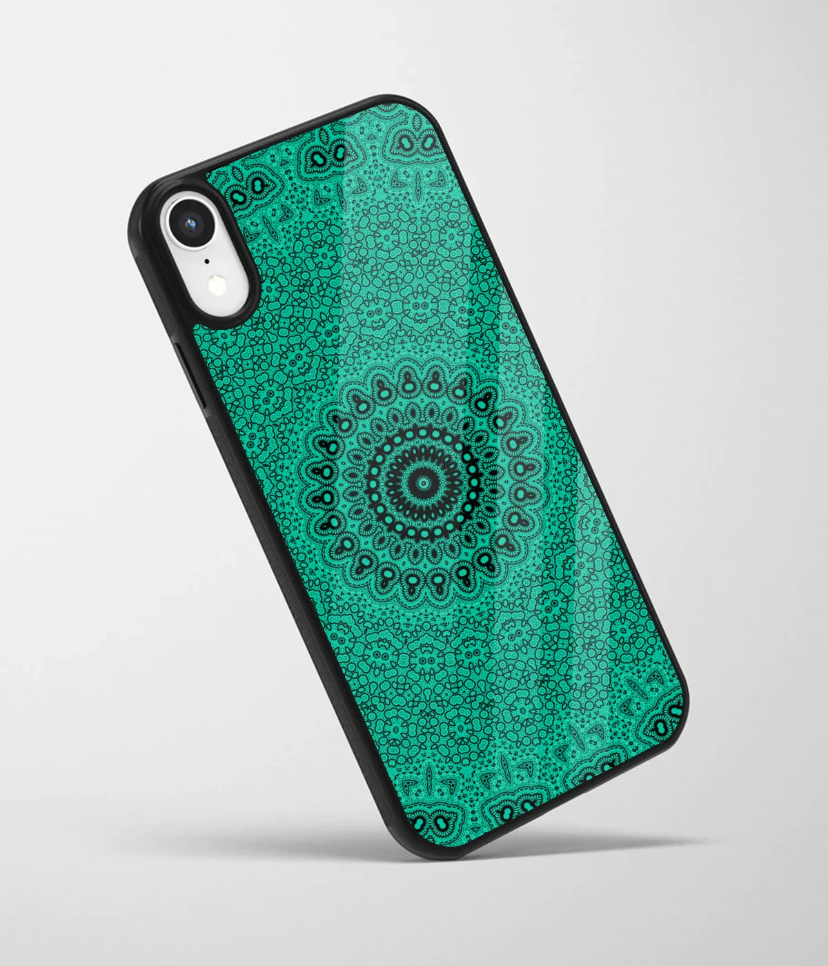 An angled view of a glass phone case featuring a vibrant design.
