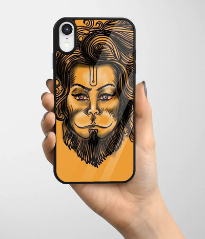 A hand holding a glass phone case with a colorful design.