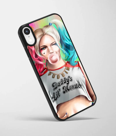 An angled view of a glass phone case featuring a vibrant design.